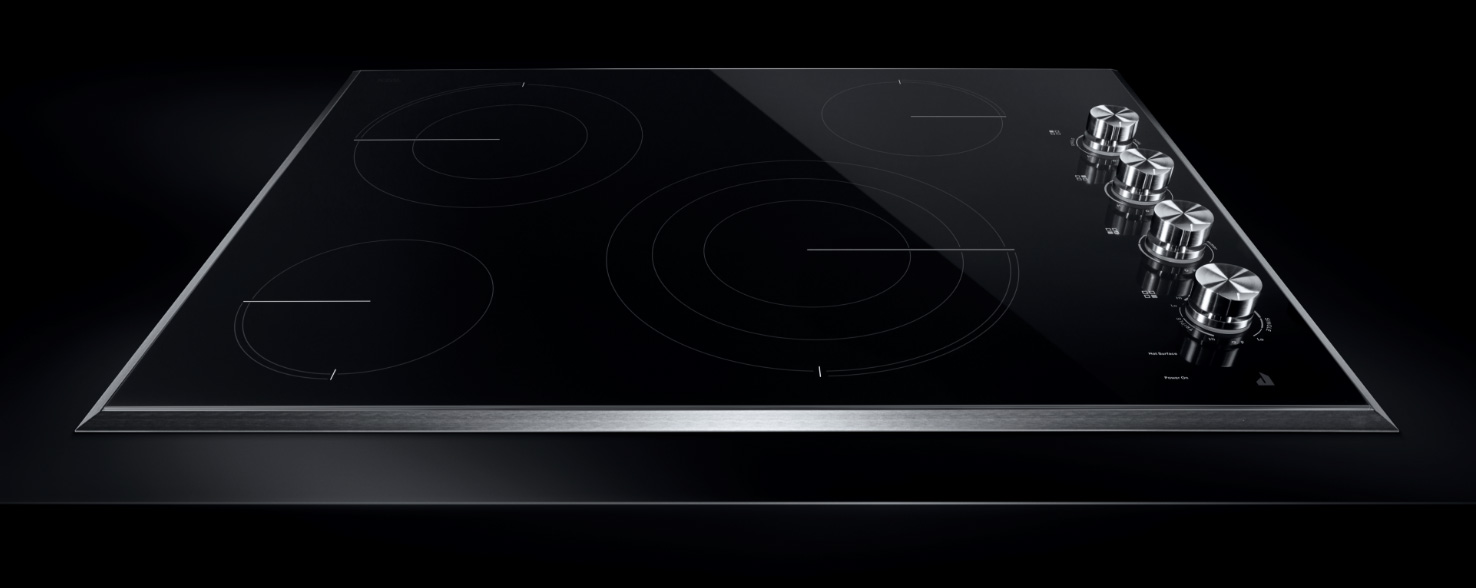 A JennAir Ceramic Cooktop with knobs