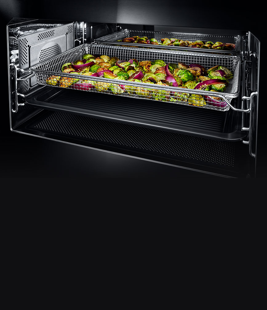 The interior of the built-in microwave or speed oven with the grill element activated.