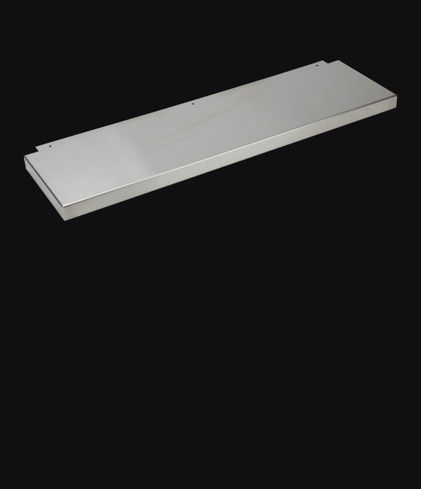 A cooktop backsplash isolated on a black background.