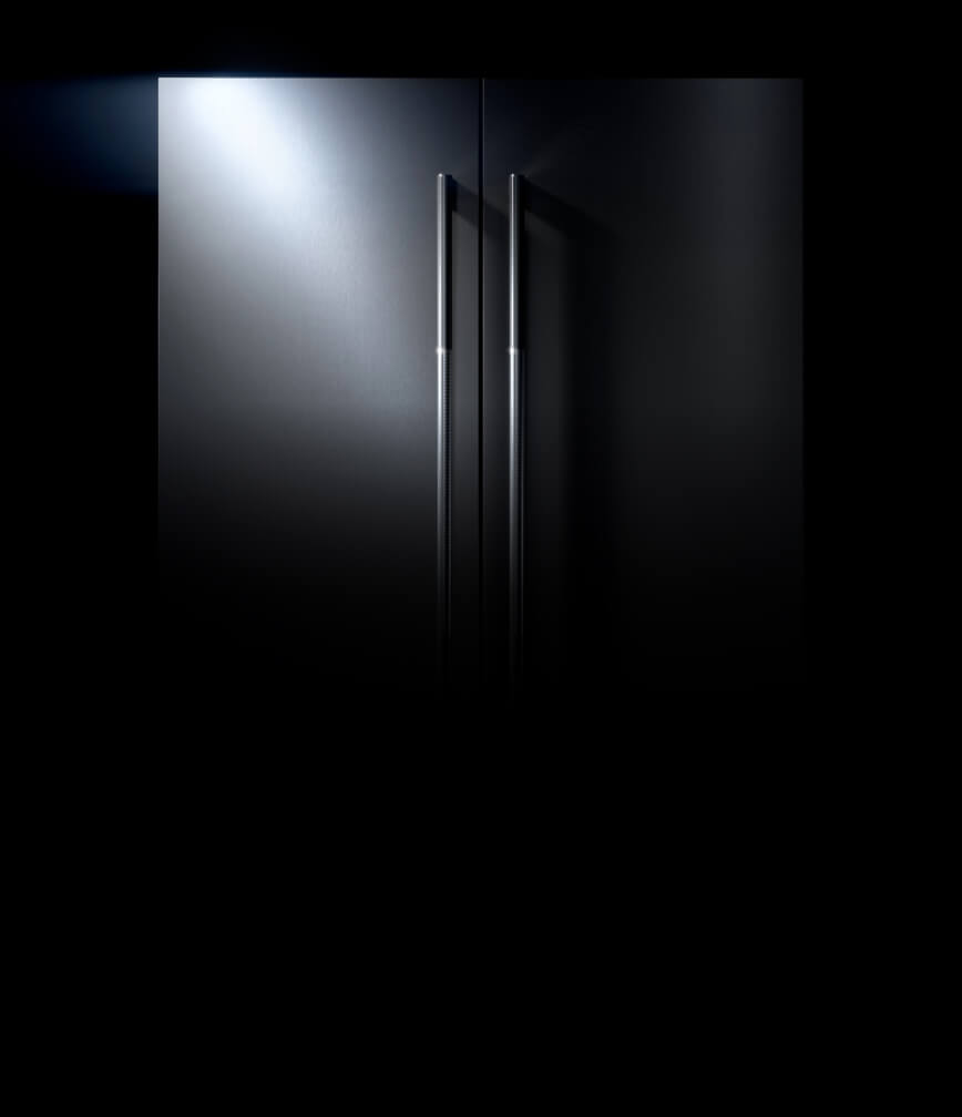 The exterior of a JennAir® refrigerator fitted with RISE™ design panels.