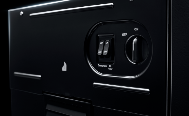 Boutons du panneau de commande d’un compacteur à déchets JennAir