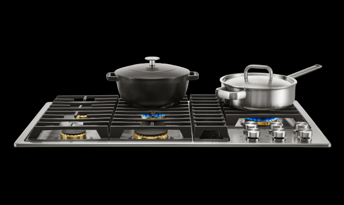 Variety of cooking pots on a downdraft cooktop, showcasing versatility. Variety of cooking pots on a downdraft cooktop, showcasing versatility.