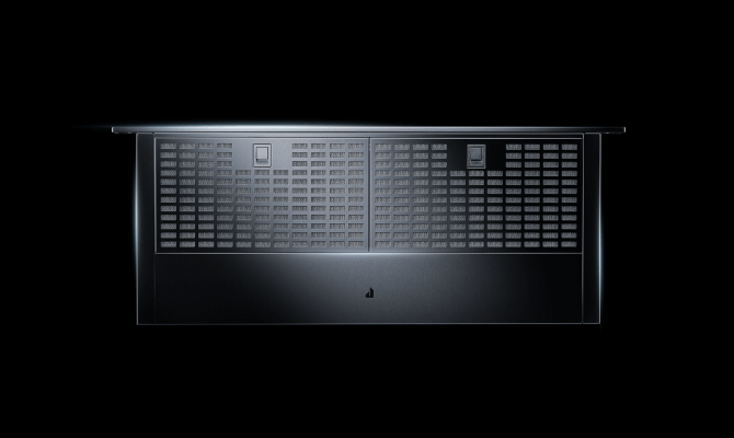 Extended downdraft vent system rising behind a cooktop, illustrating its functionality and design. Extended downdraft vent system rising behind a cooktop, illustrating its functionality and design.
