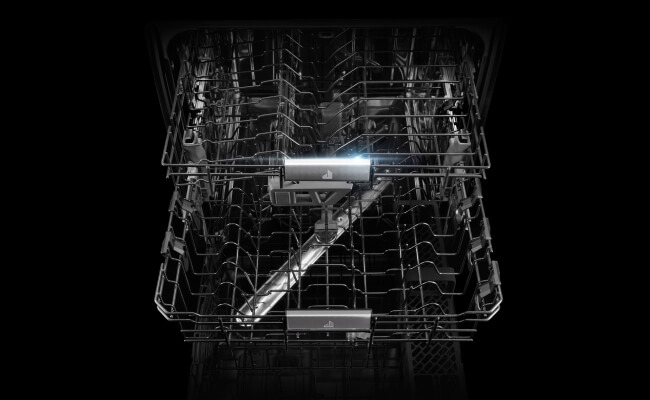 The pulled out racks of a JennAir dishwasher