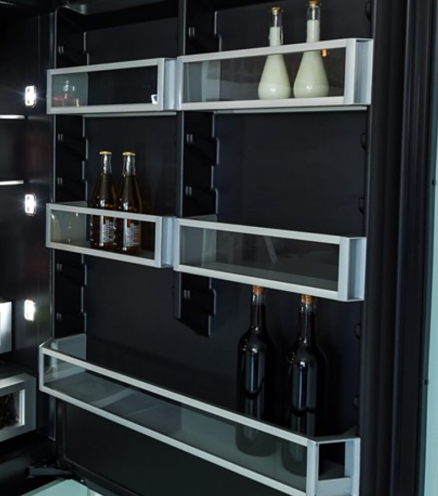 The door bins of a JennAir® Built-In Refrigerator in the Bottom-Freezer configuration.