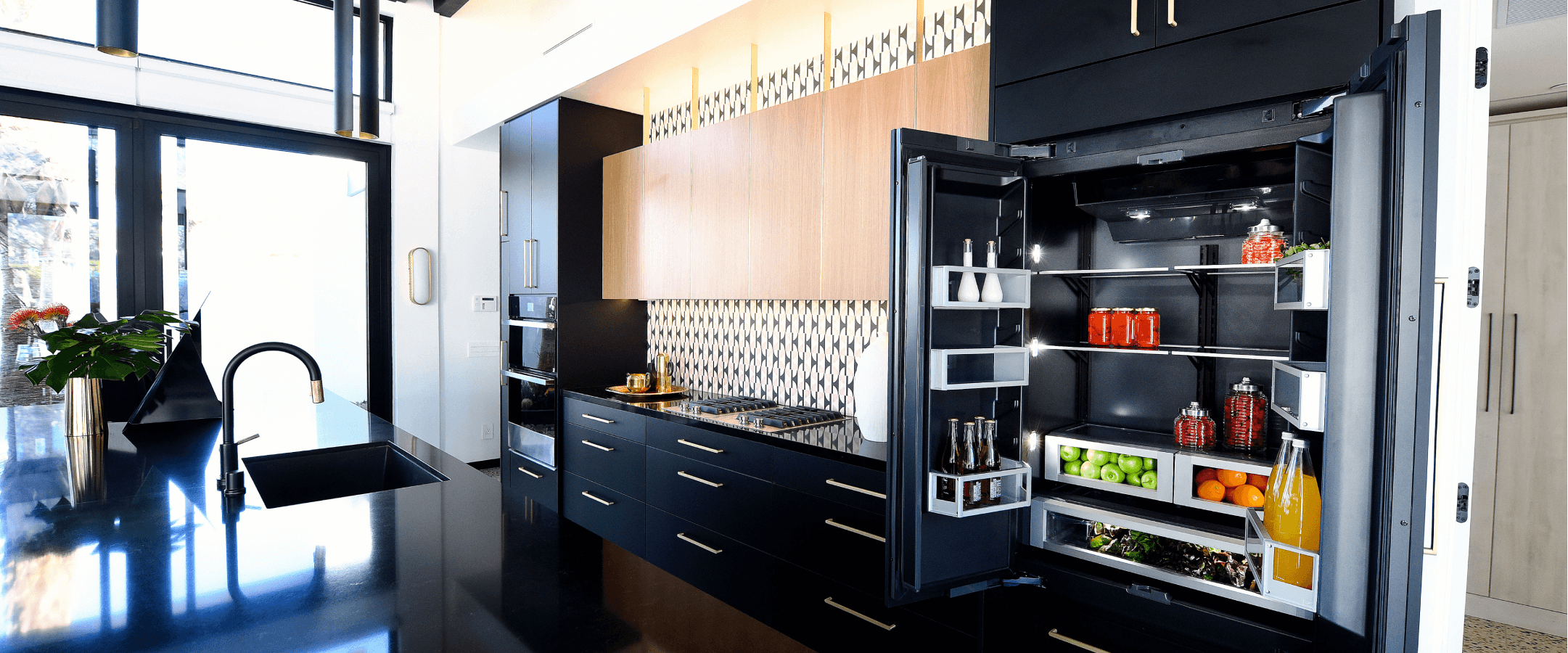 A JennAir® Built-In French Door Refrigerator in a beautifully designed kitchen.