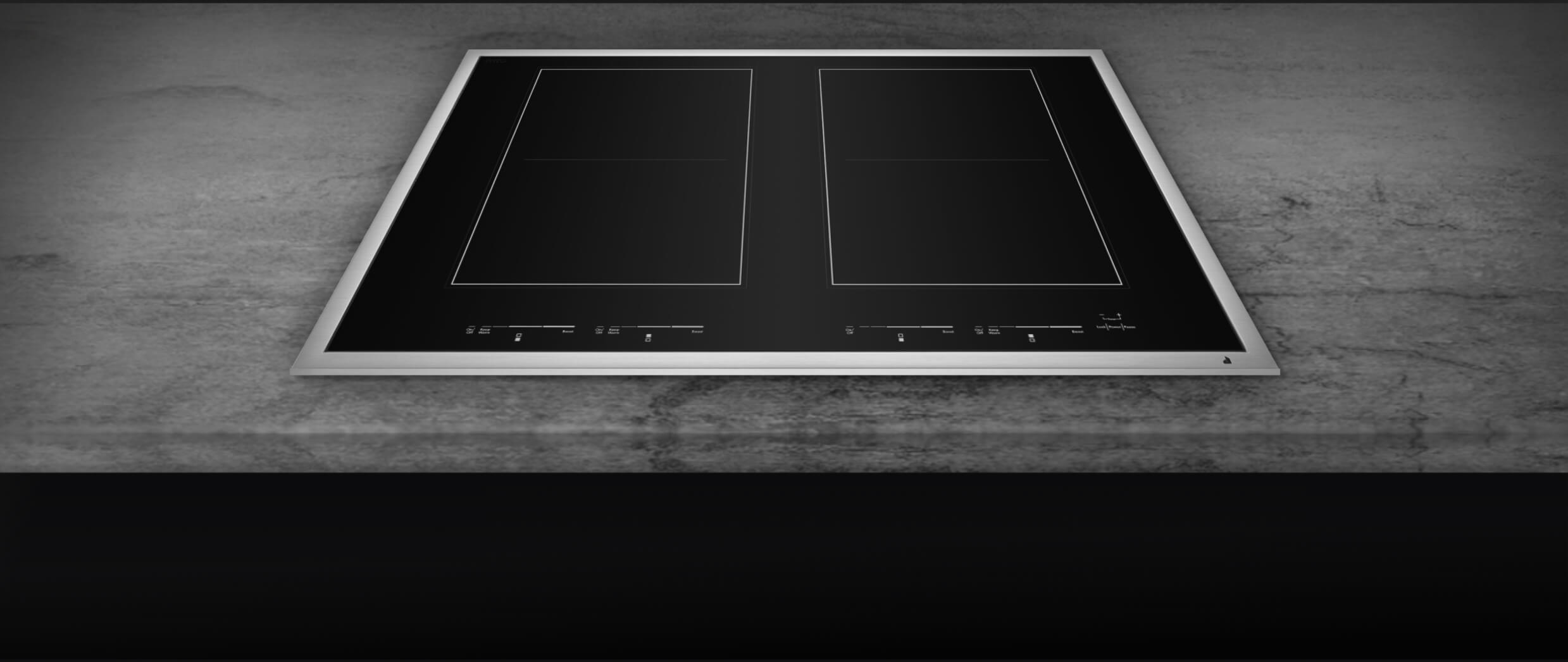 Un gros plan sur le cadre en métal brossé d'une table de cuisson.