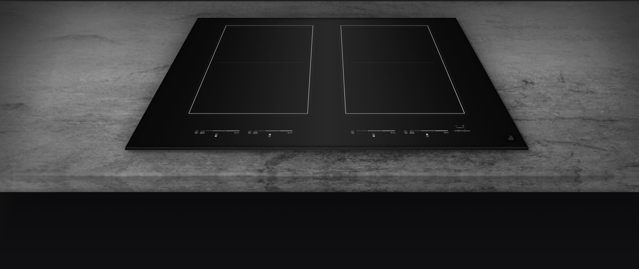 Un gros plan sur la surface en verre noire d’une table de cuisson.
