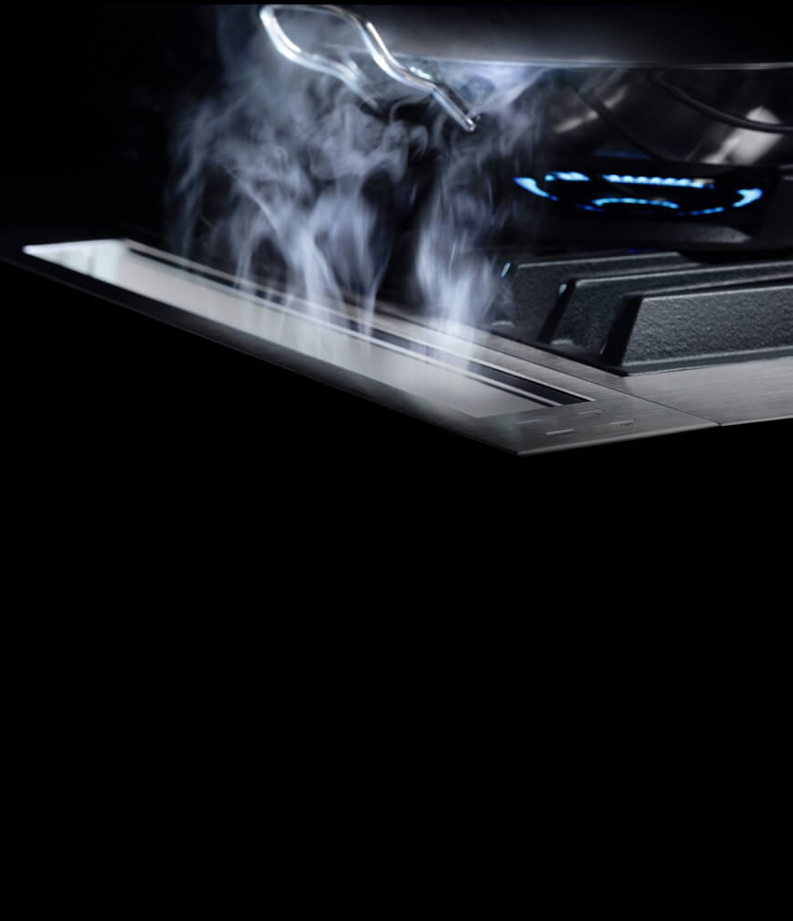 The 4-inch downdraft strip drawing steam away from the cooking surface.