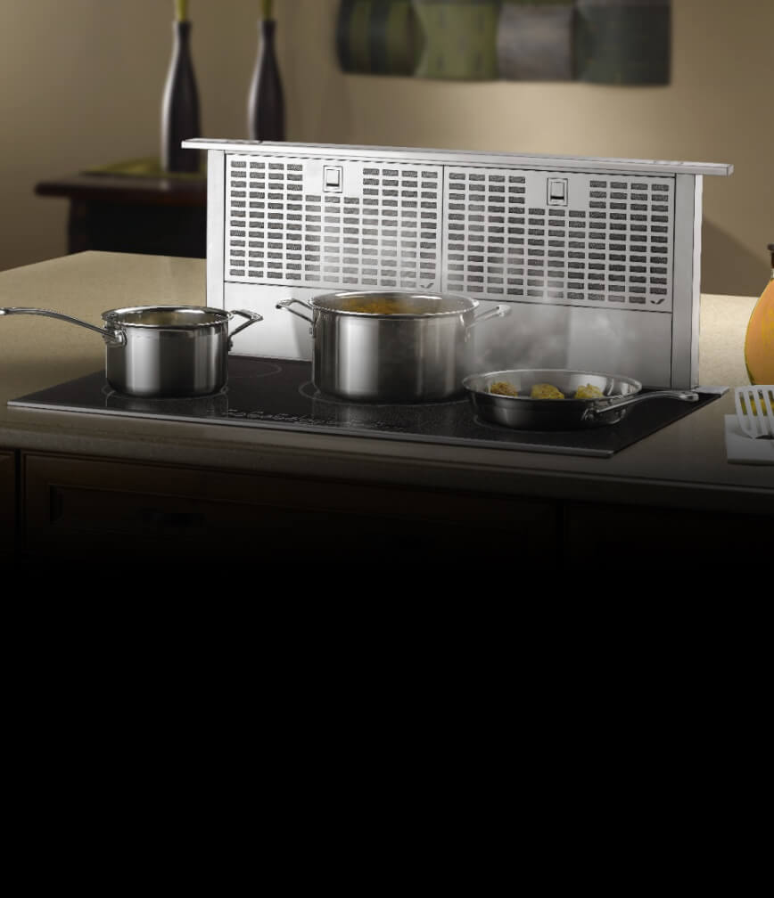 A telescoping downdraft ventilation hood.