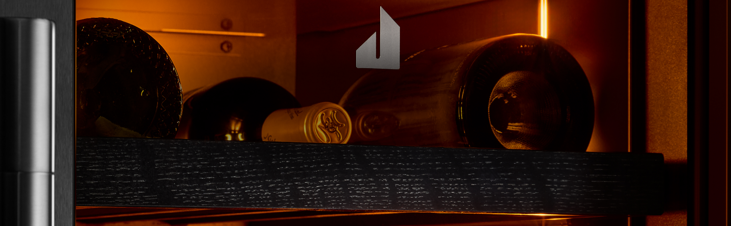 The interior of the JennAir® wine column refrigerator, showing the Ambra Lighting.