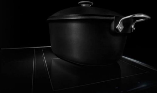 Black pot on an induction cooktop
