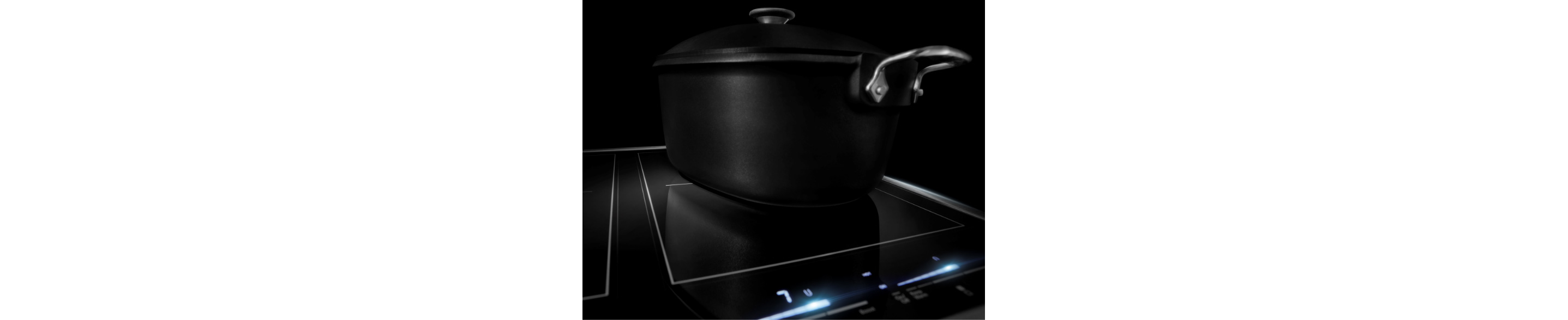 On a JennAir Ceramic Cooktop is a lidded black pot. Some of the controls are lit white