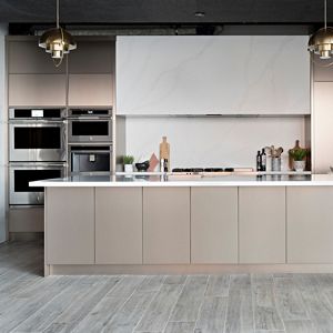 A luxury kitchen with neutral tones and JennAir appliances