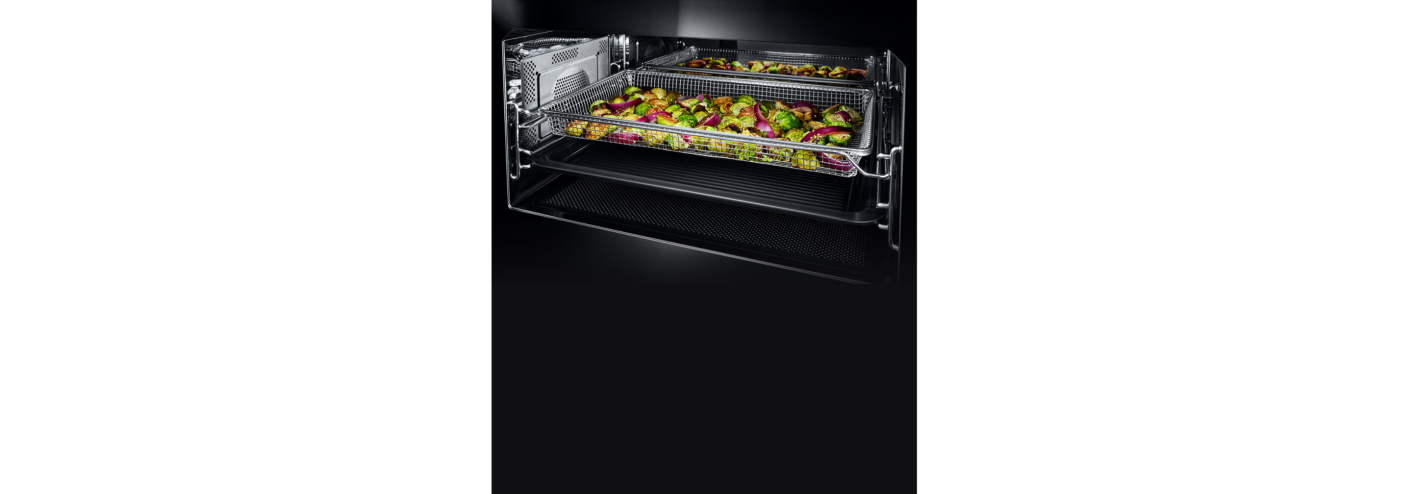The interior of the built-in microwave or speed oven with the grill element activated.