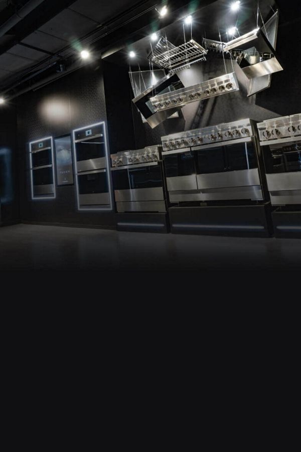 The NOIR™ Design Professional-Style Ranges and Wall Ovens display at a JennAir showroom.