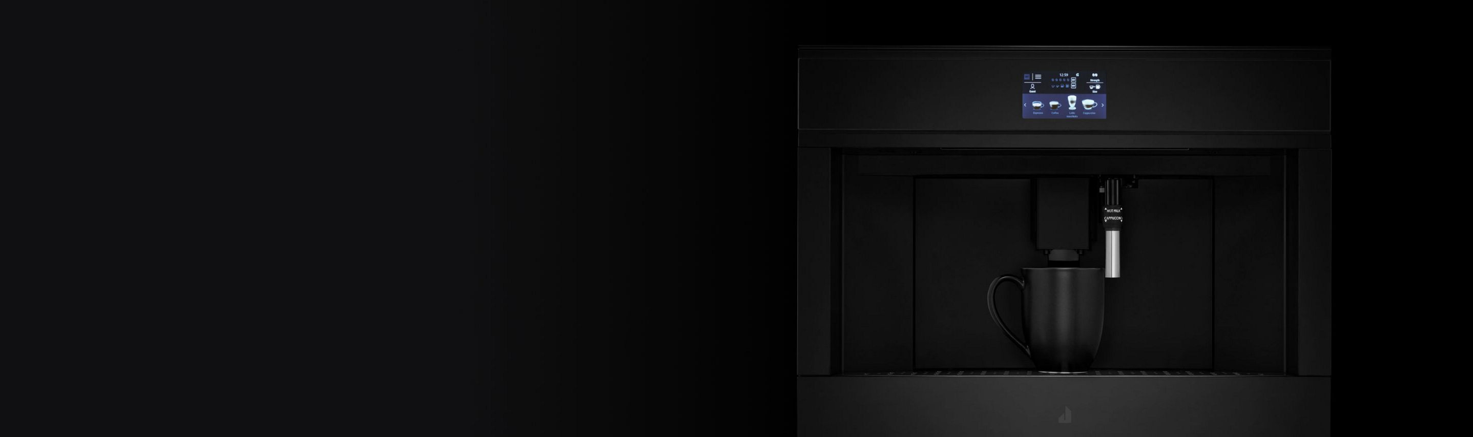 A JennAir built-in coffee maker with a mug under the dispensing spout.