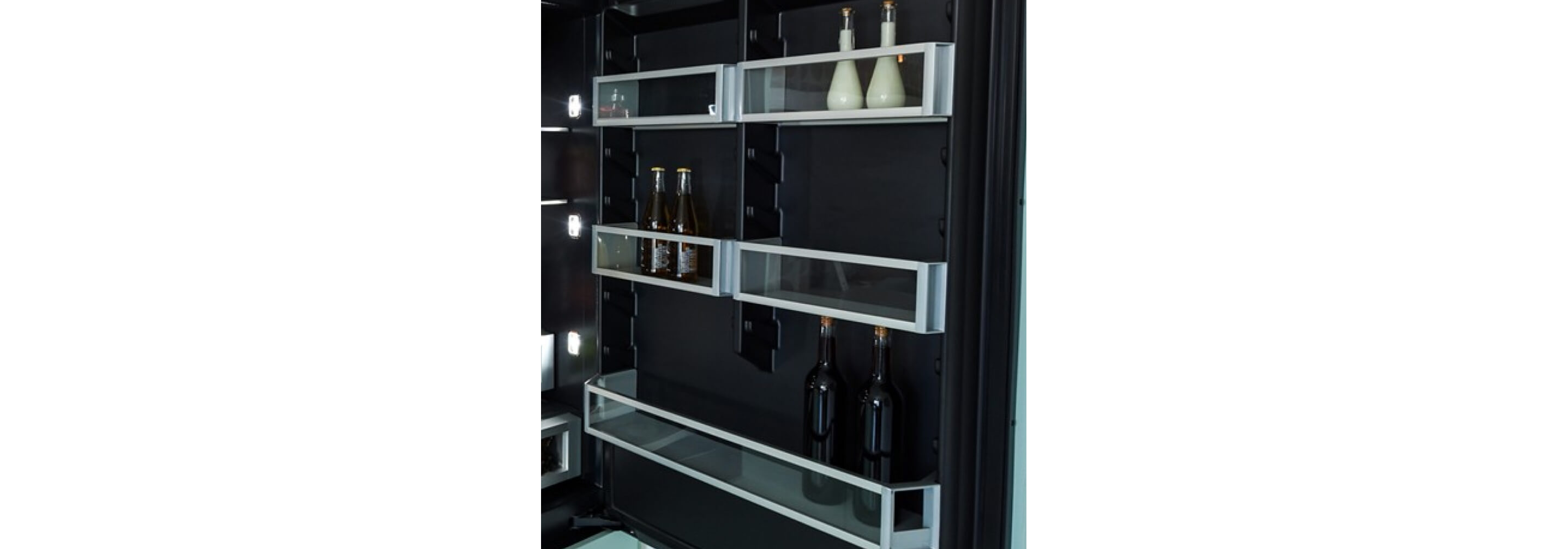 The door bins of a JennAir® Built-In Refrigerator in the Bottom-Freezer configuration.