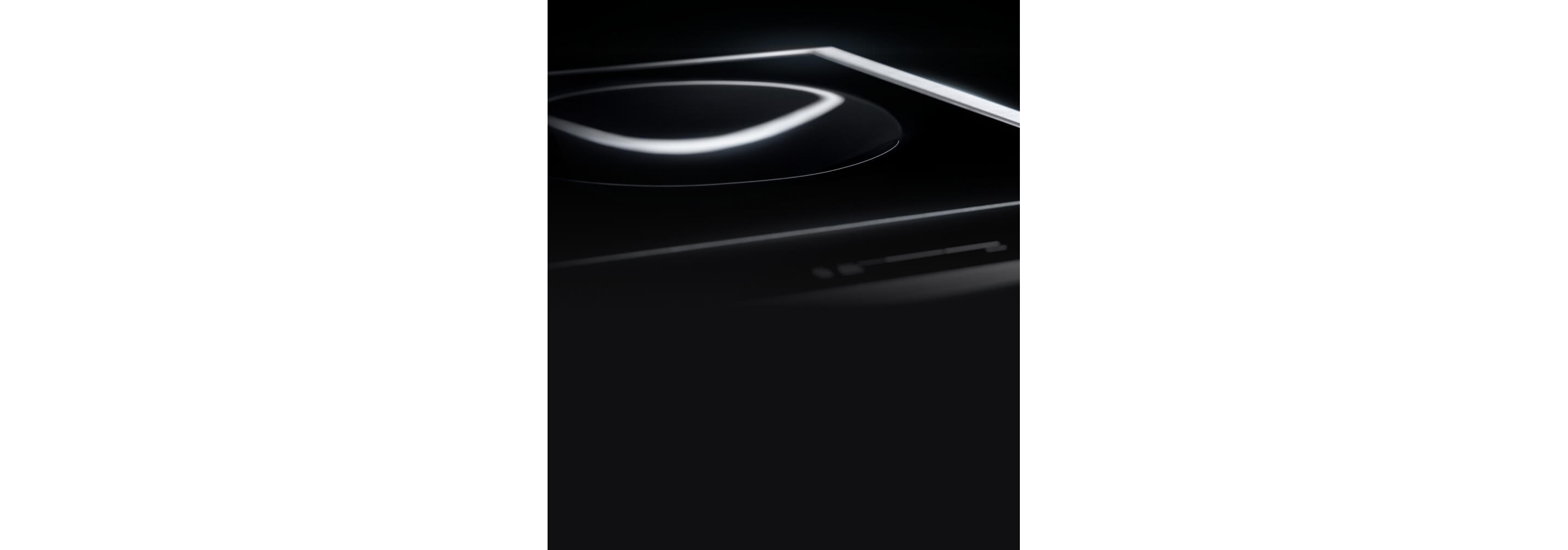 The 15-inch Induction Wok Cooktop with light highlighting the smooth concave wok element.