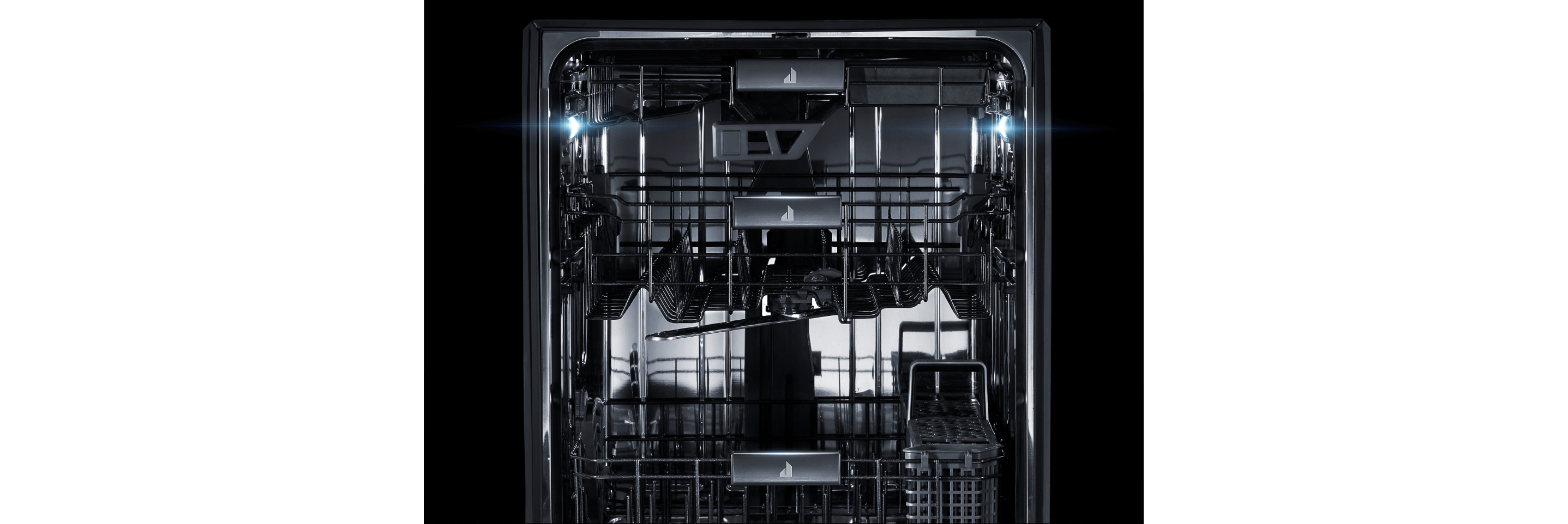 The interior of a JennAir® dishwasher, lit up and clearly visible.