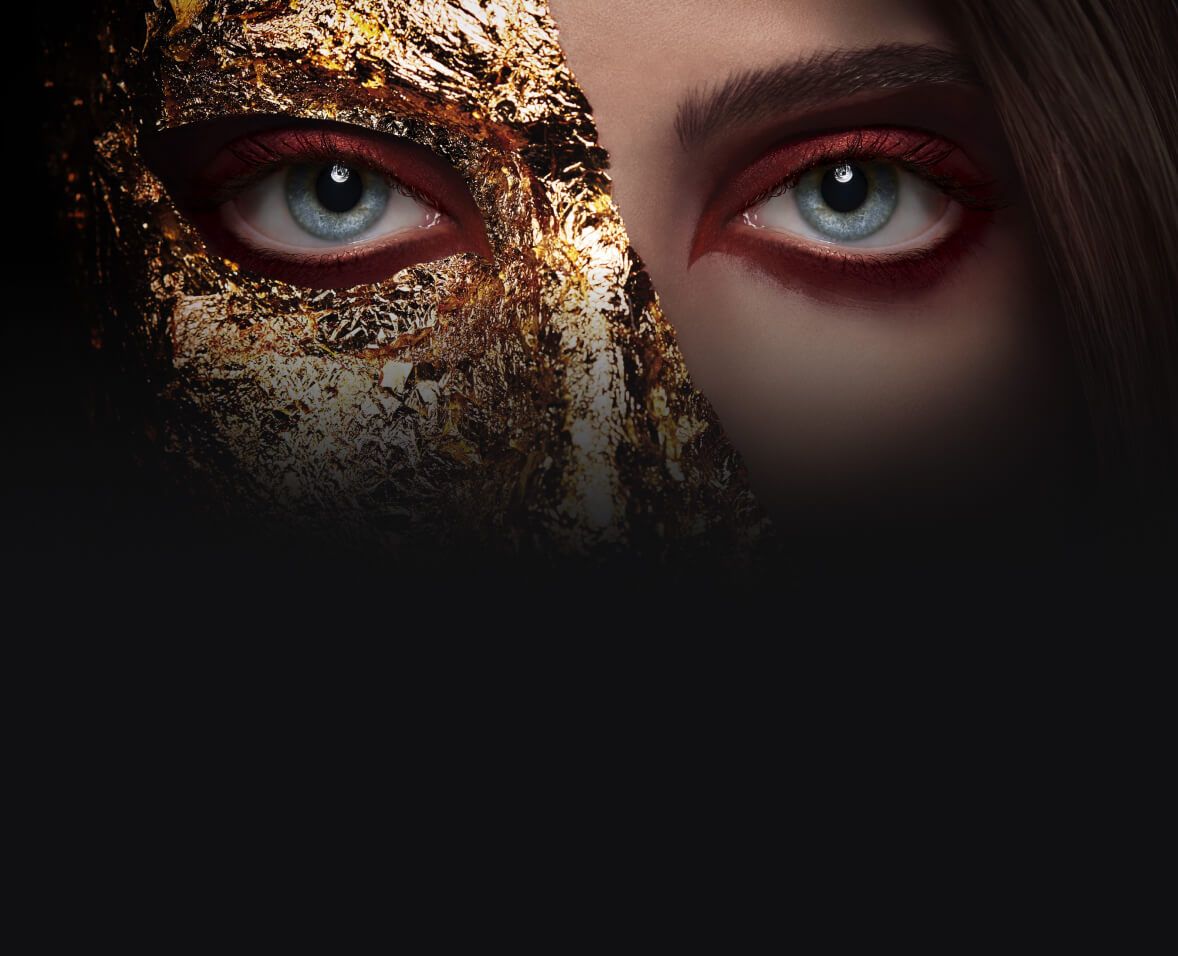 A woman with half her face in gold foil.