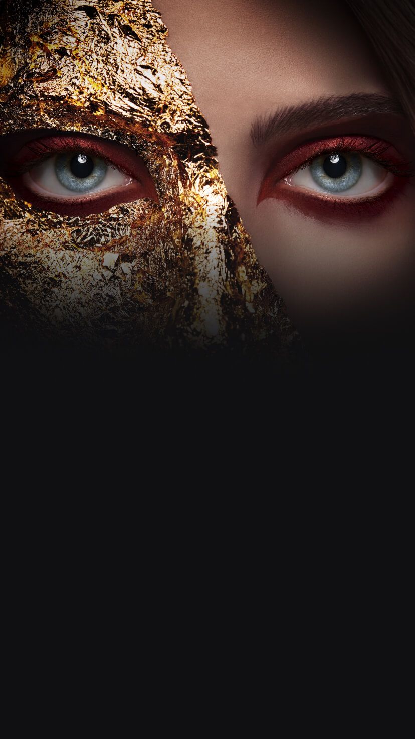 A woman with half her face in gold foil.