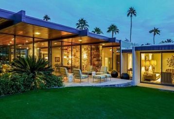 The exterior of the Dinah Shore Estate in the evening.