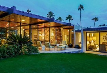 The exterior of the Dinah Shore Estate in the evening.