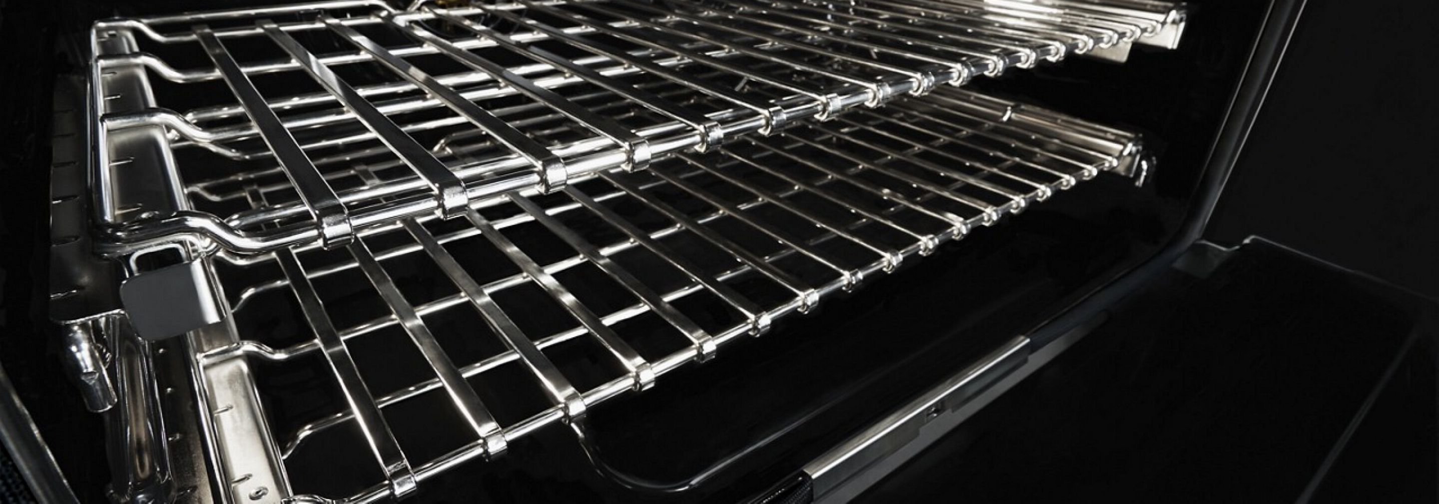 A close up of the flat tine glide racks inside a JennAir® Range.
