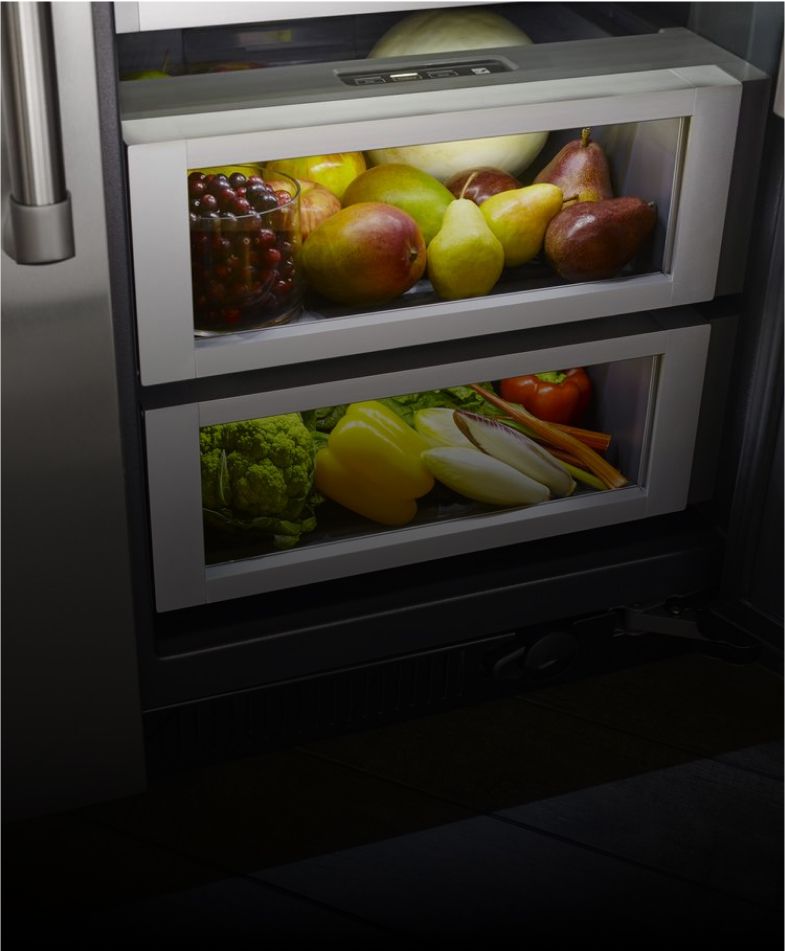 Climate-controlled produce drawers inside a JennAir[®] built-in refrigerator.