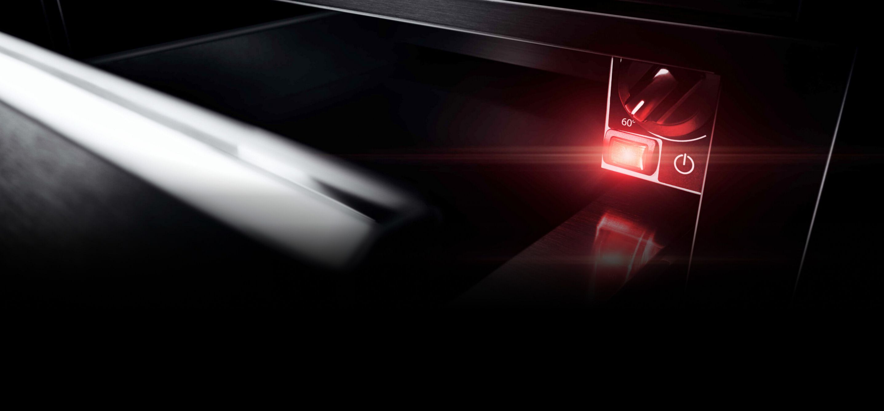 Un tiroir-réchaud JennAir® ouvert avec la lumière allumée.